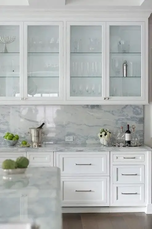 Marble Backsplash and Glass Cabinets