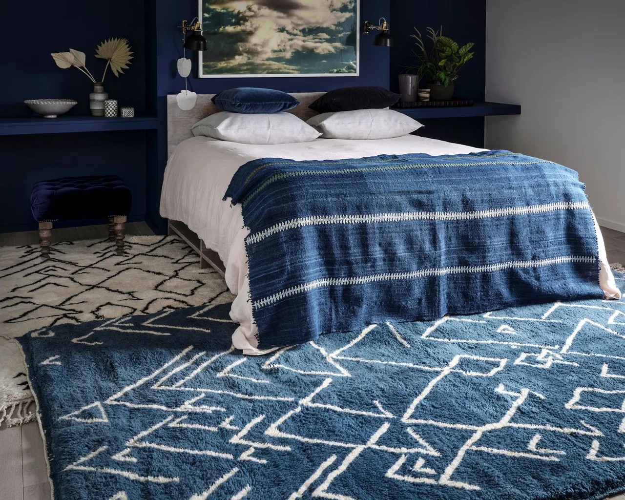 Layer your rugs for a cozy bedroom scheme